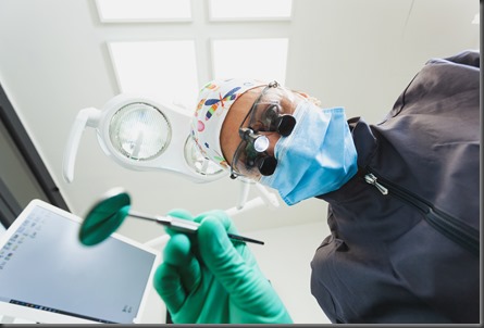 The patient's first person view at the examination by the dentist lies in the dental chair.