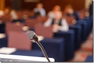 Microphone over conference hall background, Business meeting concept