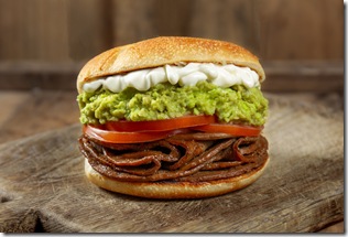 CHILEAN FOOD. Sandwich Churrasco italiano on colors of italian flag. Popular sandwich with round bread, beef, avocado guacamole, tomatoes and mayonnaise