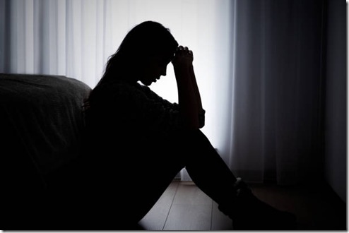 Woman suffering from depression. Sadness and headache concept