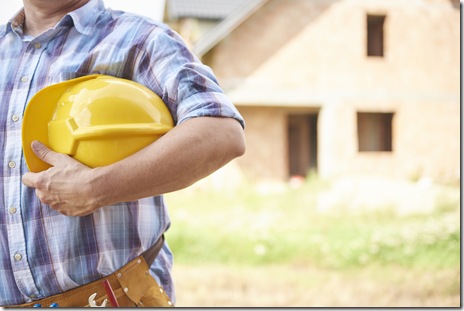 Part of manual worker standing outdoors