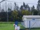Personal de Aguas Araucanía realizando labores de limpieza y sanitización en calles tras reboses de alcantarillado por lluvias
