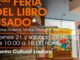 Personas explorando una selección de libros usados y vinilos en la Feria del Libro de Lautaro