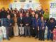 Entrega de ayuda alimentaria para ganado a pequeños agricultores afectados por inundaciones en La Araucanía.