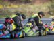 Pilotos compitiendo bajo una intensa lluvia en el Campeonato Regional de Karting en Temuco