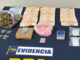 Agentes de la PDI incautando diversos tipos de drogas y dinero en efectivo tras operativo en Villarrica