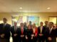 Autoridades y familias celebrando la aprobación del proyecto de regularización de títulos de dominio