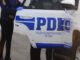 Detectives de la PDI de Temuco realizando un operativo policial por deudas de pensiones